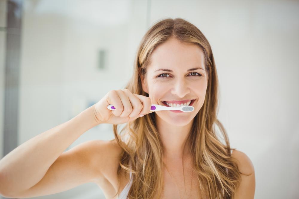 Young Woman Brushing Teeth Young Woman Brushing Teeth